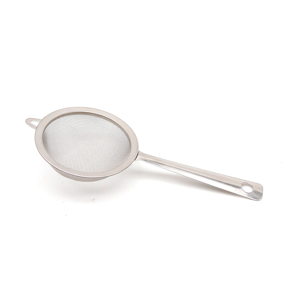 Metallic strainer on a white background