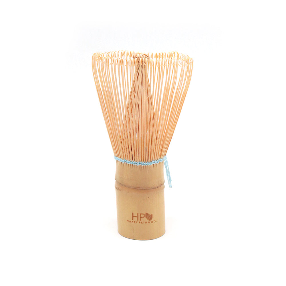 Bamboo whisk with a wooden handle and blue string on a white background