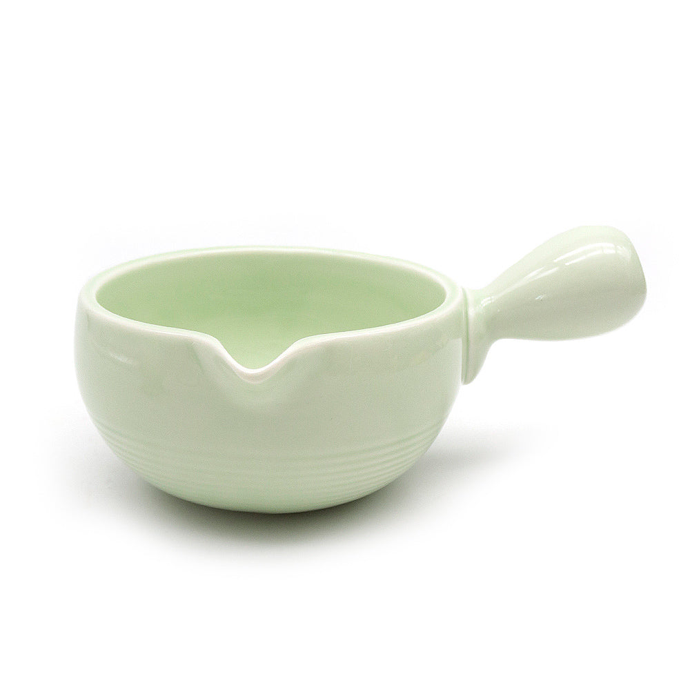 Light green ceramic matcha bowl, chawan, on a white background