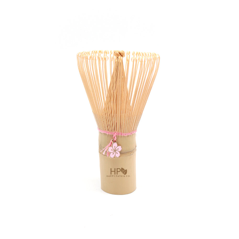 bamboo whisk with pink flower ornament