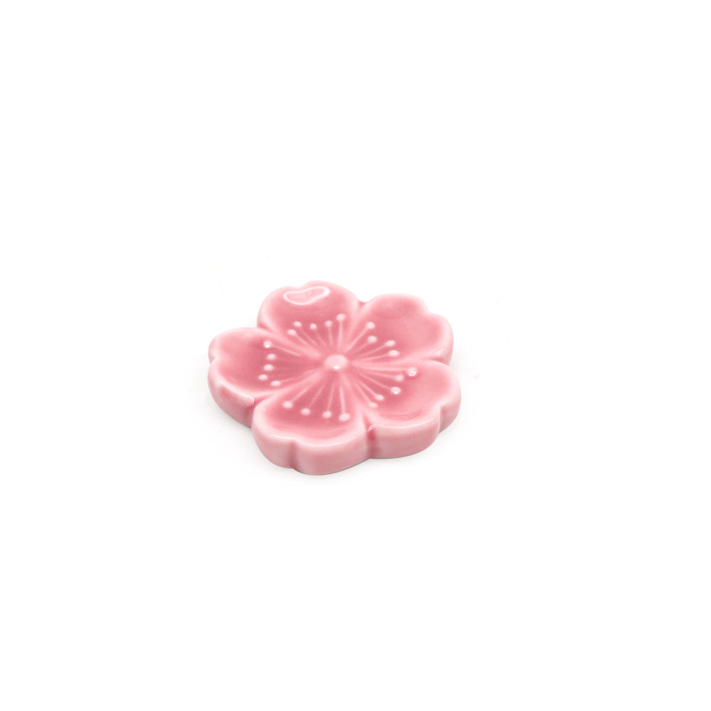 pink ceramic flower scoop stand on white background