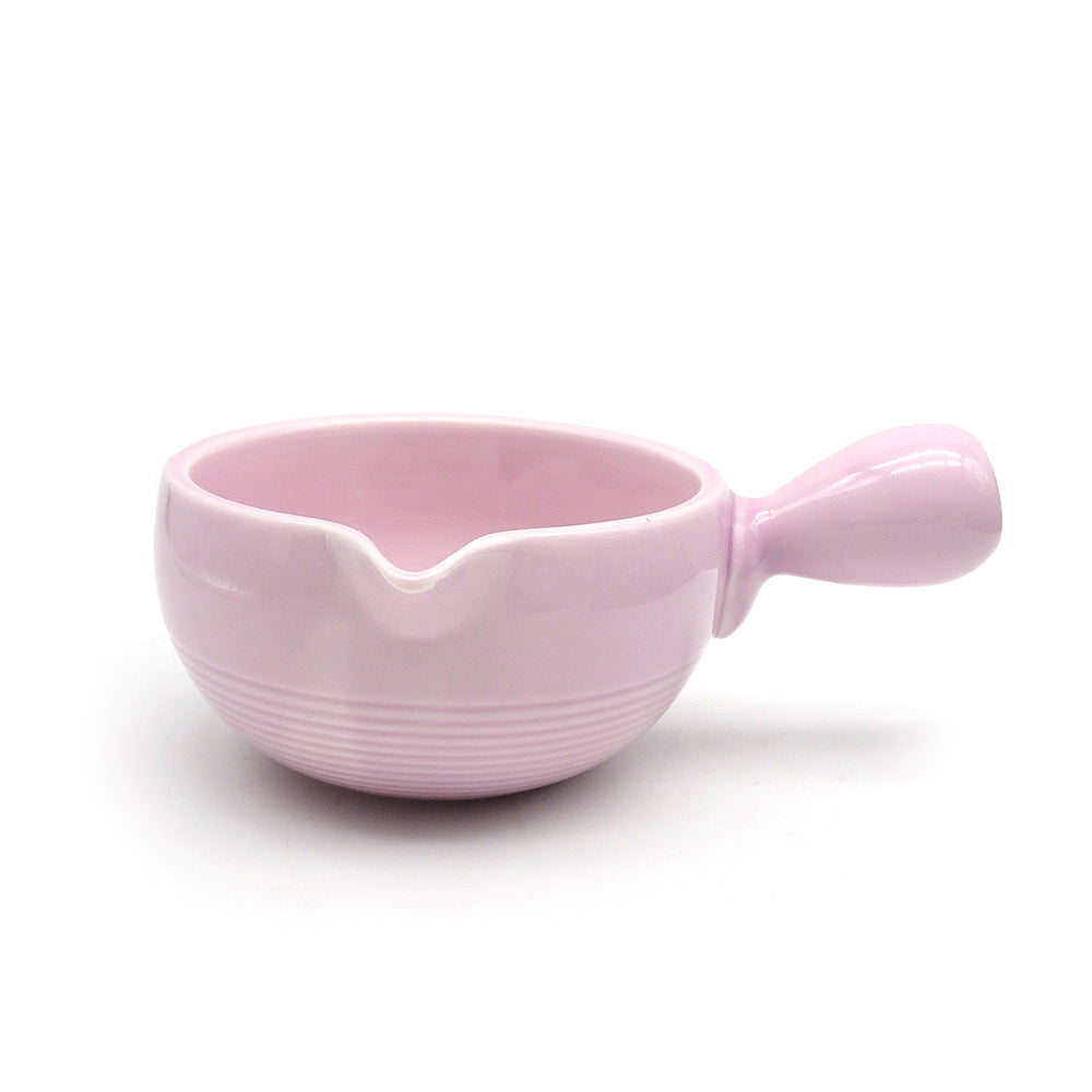 light purple ceramic matcha bowl chawan with handle on a white background
